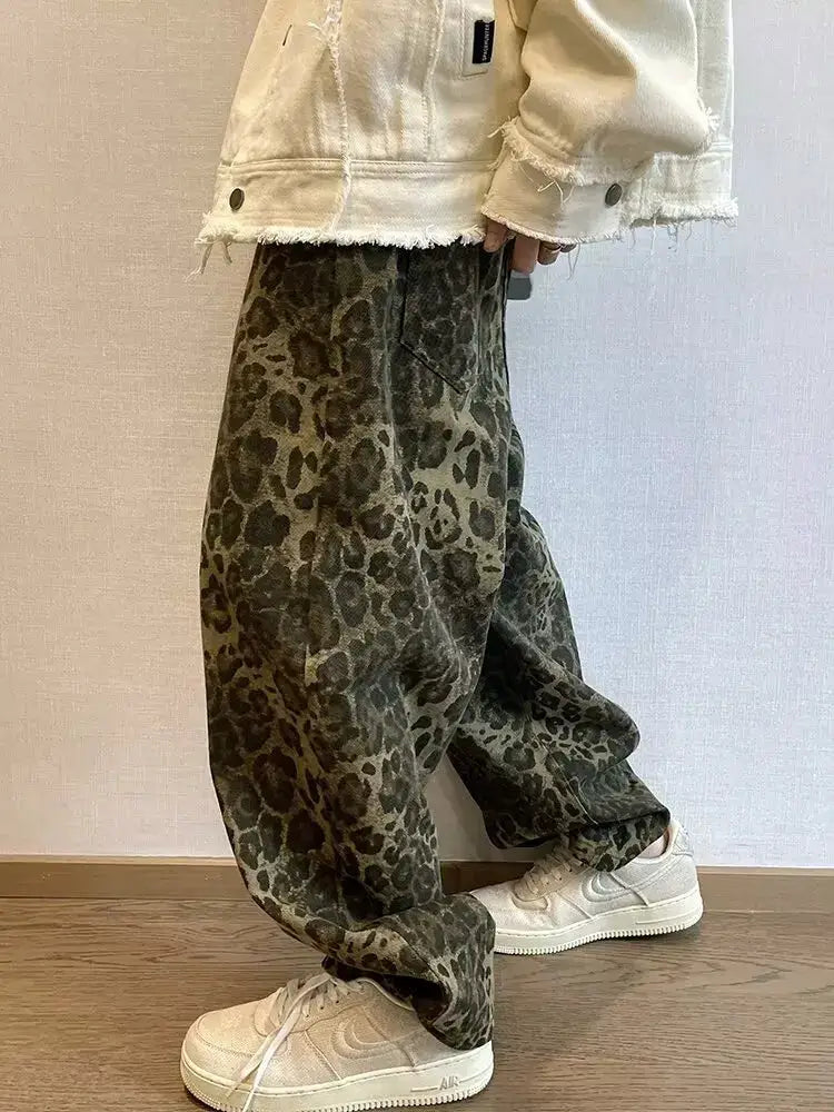 Leopard print oversized men's denim pants with wide legs in olive-green tones.