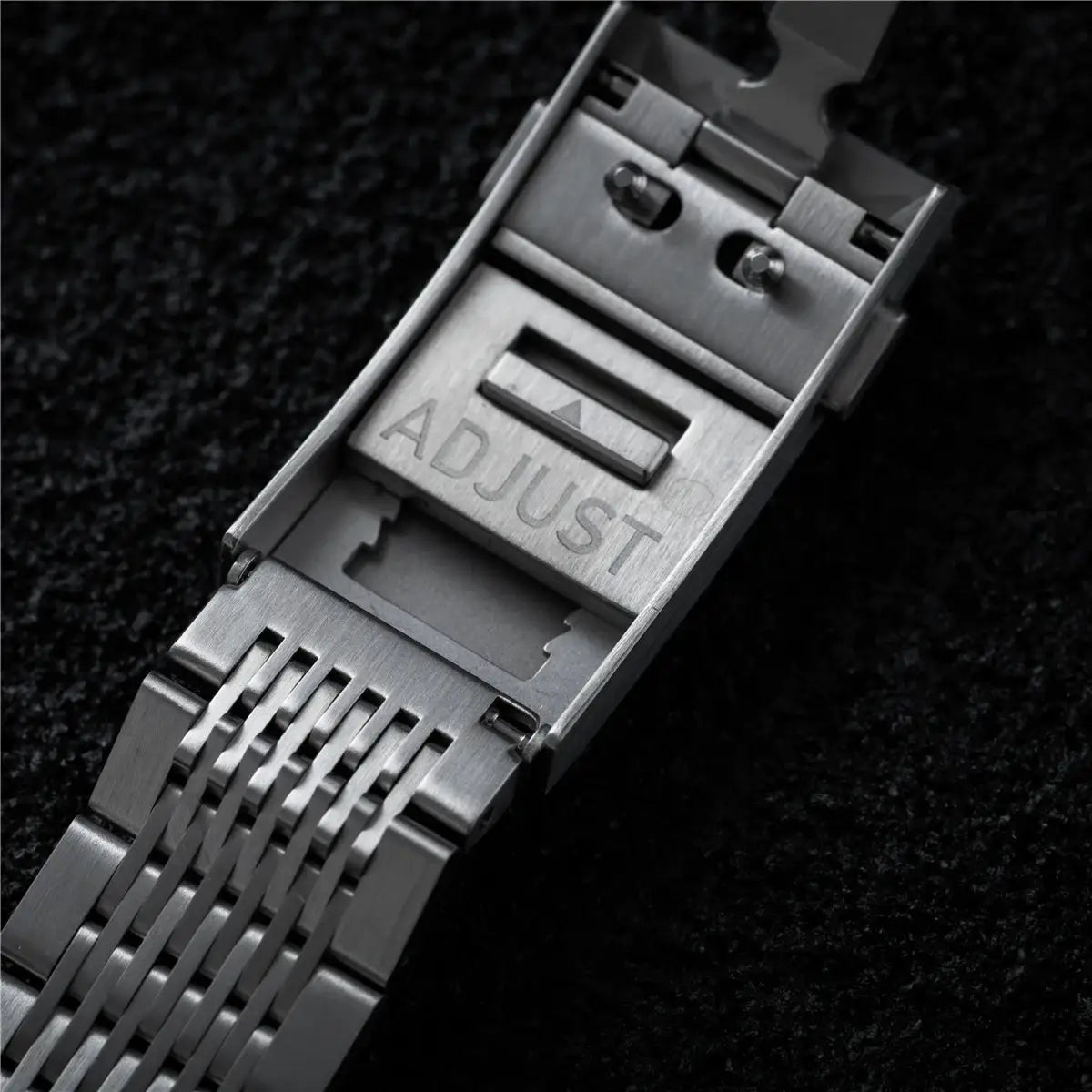 Stainless steel watch bracelet with adjustable clasp engraved ADJUST