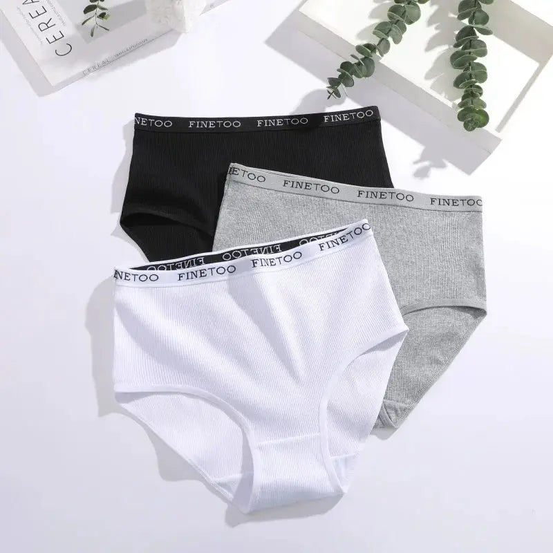 Set of three women's seamless cotton briefs in black, white, and gray with Finetoo waistband; breathable low-rise underwear (S-XXL).