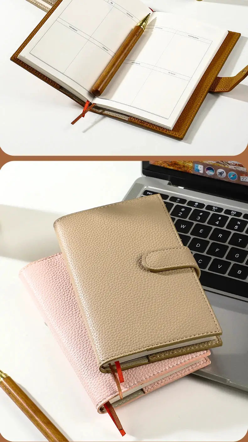 Two A6 weekly planner notebooks with pebble leather covers in beige and pink for on-the-go scheduling.