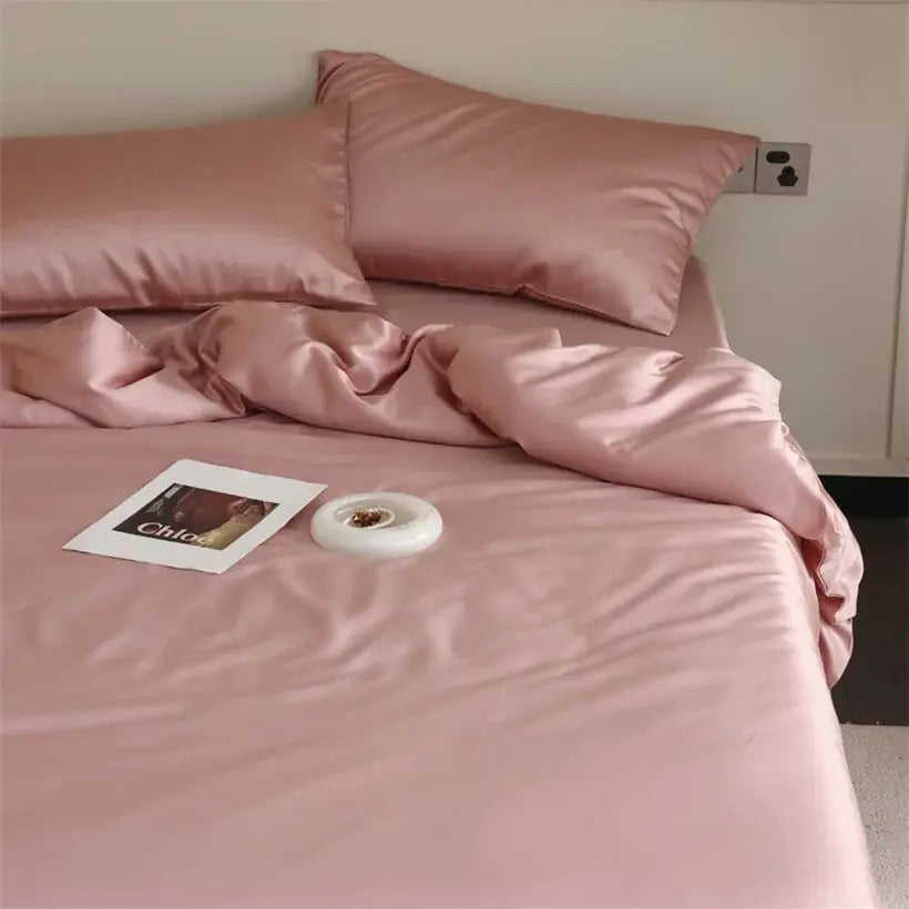 Mulberry silk bedding set by Simples Market in blush pink on bed