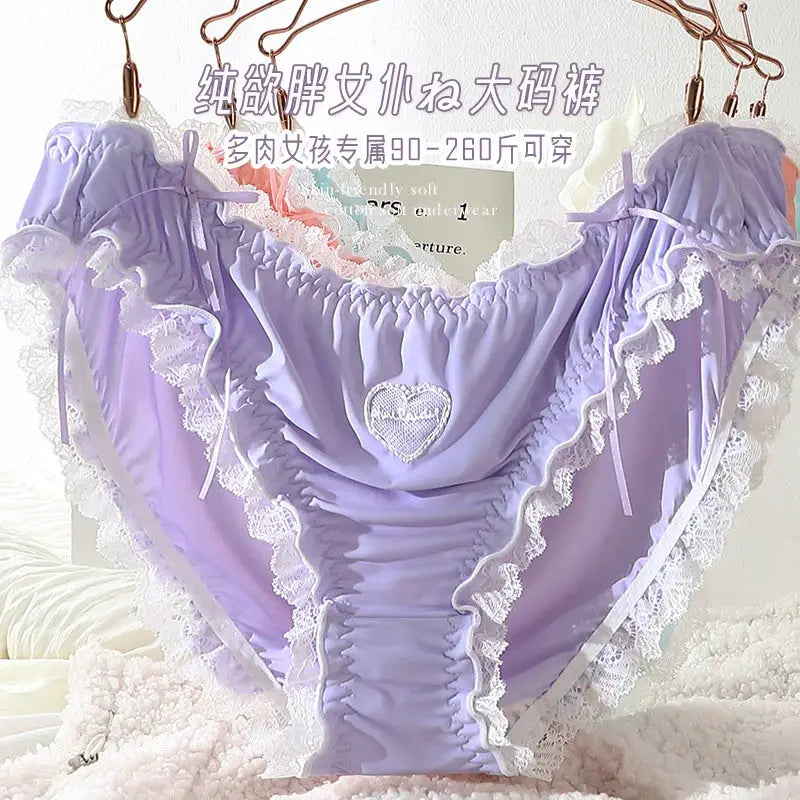 Plus-size lavender lace panties with white lace trim and heart embroidery.