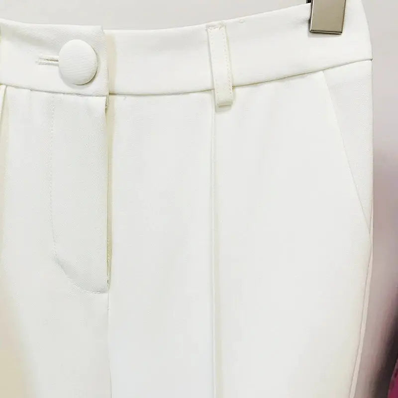 White tailored pants with button waist, belt loops, and front pocket opening.