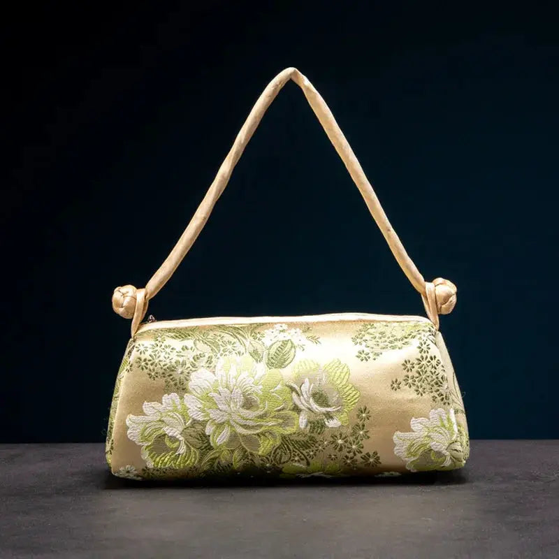 Shoulder bag with embroidered silk floral pattern on champagne satin and tan strap