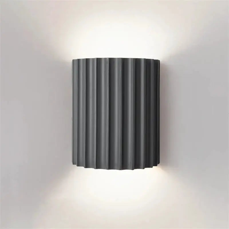 Nordic modern resin wall lamp in dark gray with vertical ribbed panels, wall-mounted bedside and living room light.