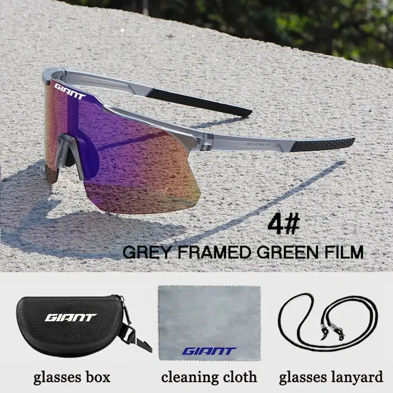 Giant cycling glasses with grey TR90 frame and green mirrored lenses; includes case, cleaning cloth, and lanyard