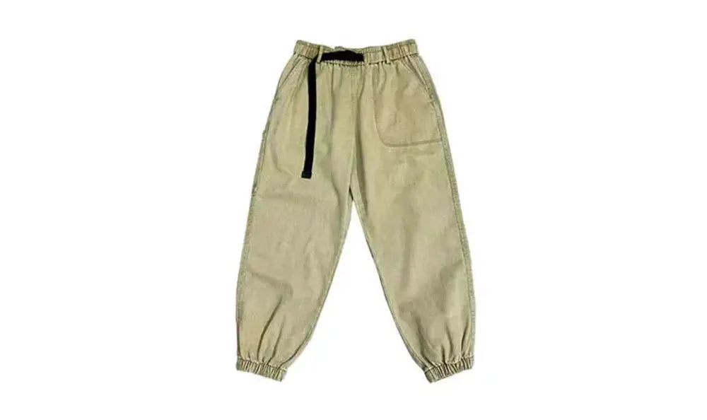 Beige baggy cargo pants with black drawstring, elastic cuffs, and front patch pocket.