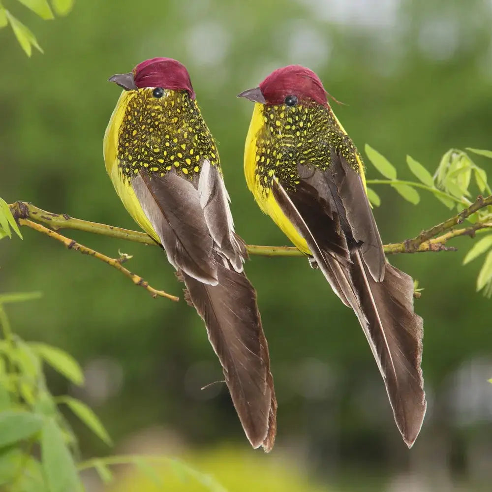 2 artificial feather sparrow birds for garden decor, red heads, yellow chests, brown wings perched on a branch