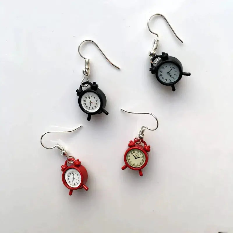 Simples Market clock earrings set with four miniature alarm-clock charms in black and red