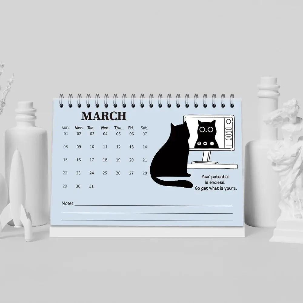 Simples Market 1pc 2026 cat-themed desktop calendar with blue page and black cat illustration.