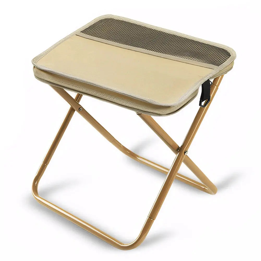 Beige folding camping stool with gold-tone metal frame for outdoor seating.