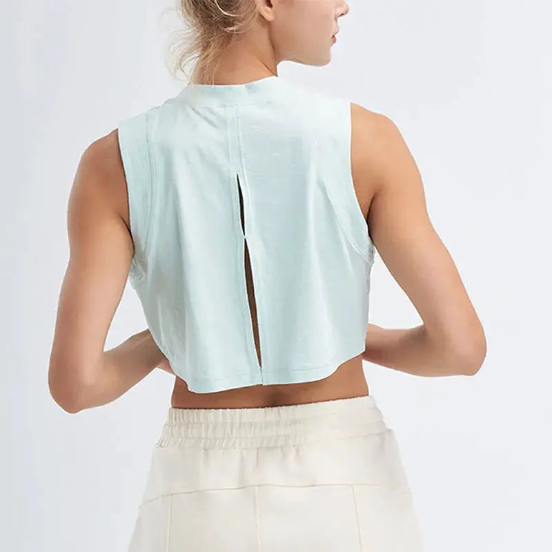 Light mint green sports shirt vest top, sleeveless with back slit, breathable quick-dry fabric.
