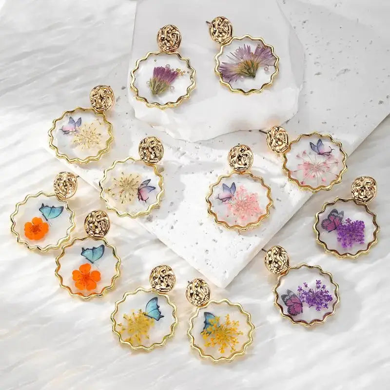 Natural flower dangle earrings with colorful pressed flowers in epoxy resin, gold scalloped hoops — 12 pairs