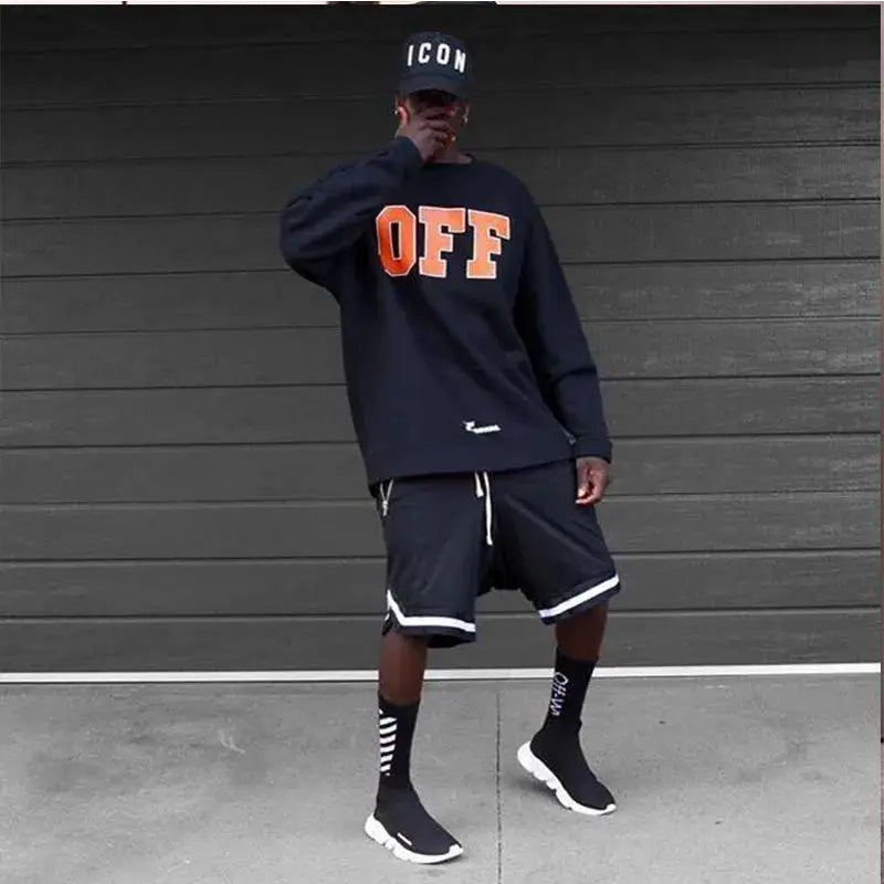 Men's black mesh quick-dry basketball shorts with white trim and drawstring.