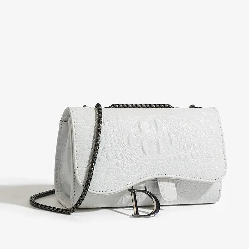 Women's luxury crossbody handbag in white textured leather with a dark metal chain strap and D-shaped clasp