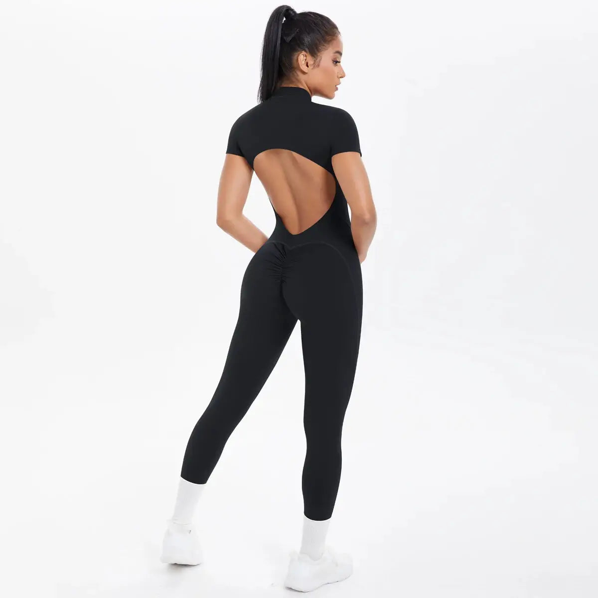 Women's black backless fitness jumpsuit with short sleeves and scrunch rear