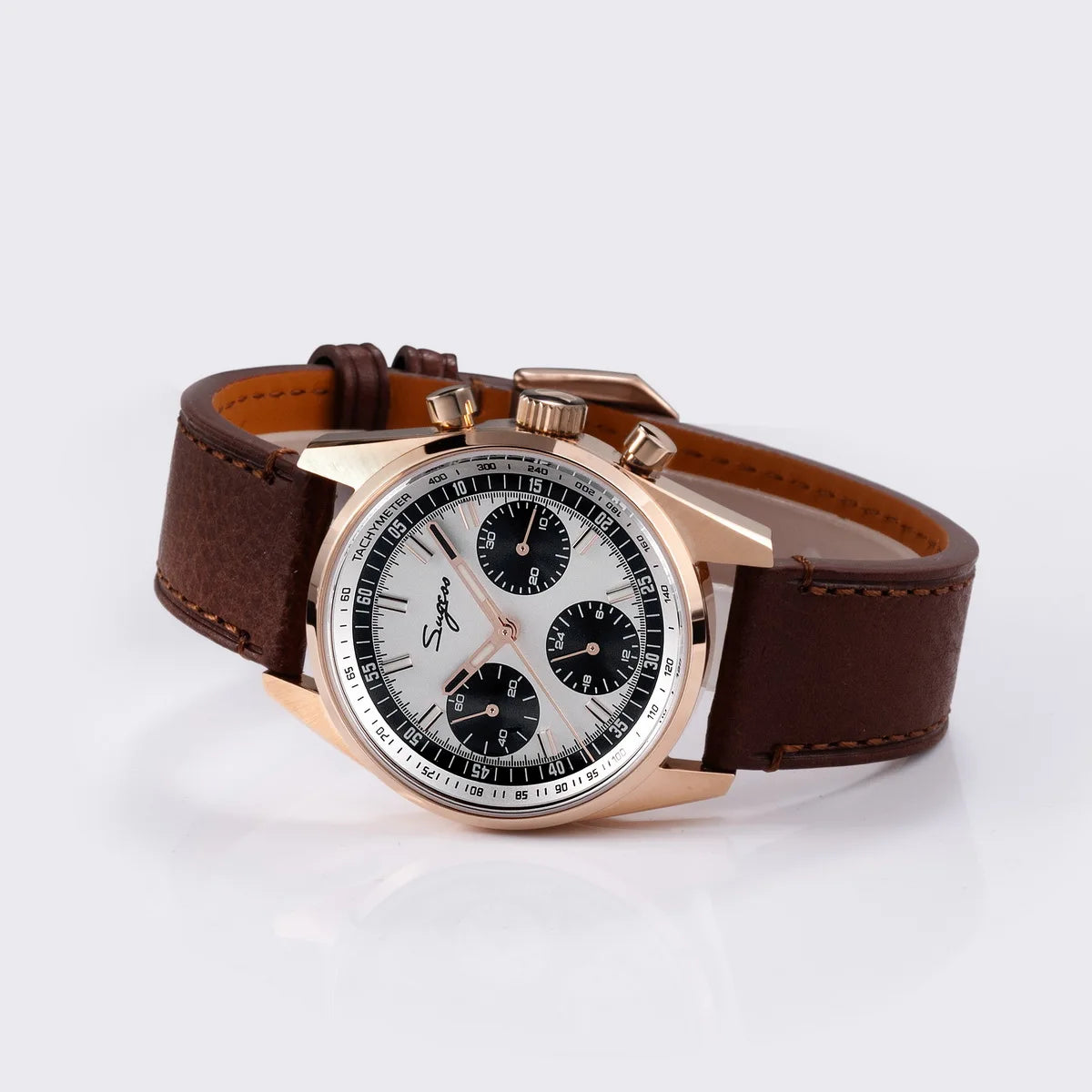 Sugess men's chronograph wristwatch with rose-gold case and brown leather strap, white dial with black subdials.