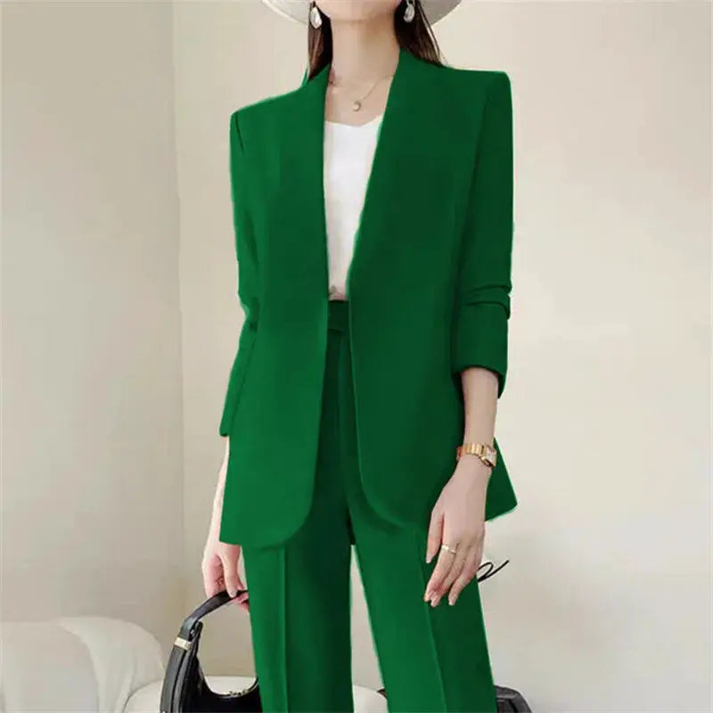 Green 2-piece women's pantsuit with blazer and matching trousers, white top underneath