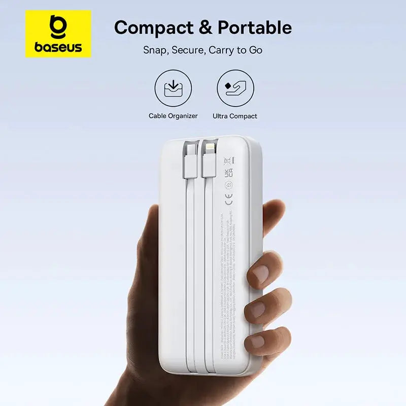 Baseus power bank 20000mAh PD 22.5W white portable charger held in hand with cable organizer
