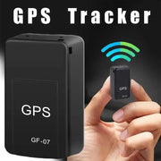 GF-07 magnetic mini GPS tracker and larger GPS unit; two black trackers for real-time vehicle and pet locating