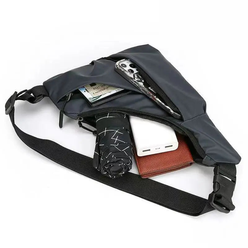 Men's gray chest bag crossbody from Simples Market with wallet, phone and umbrella visible