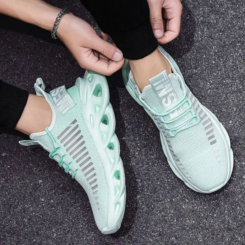 Unisex running sneakers by Simples Market, mint green and white breathable mesh, size 36–46, pair.