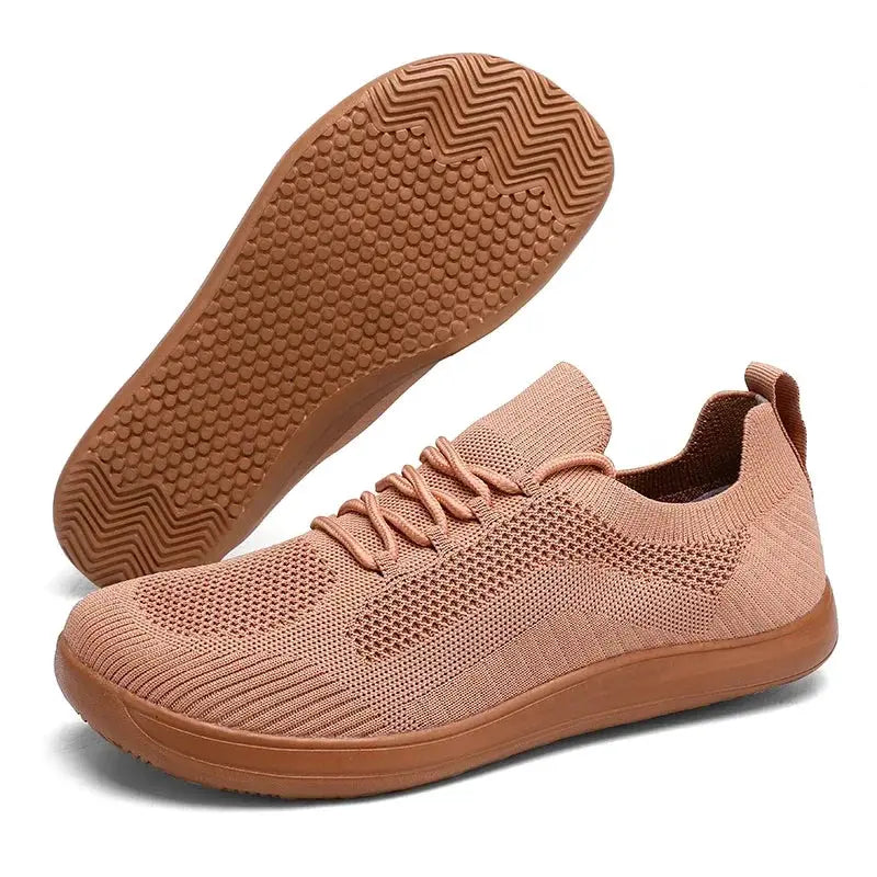 Breathable knit running shoes by Simples Market, pink mesh upper with brown outsole.