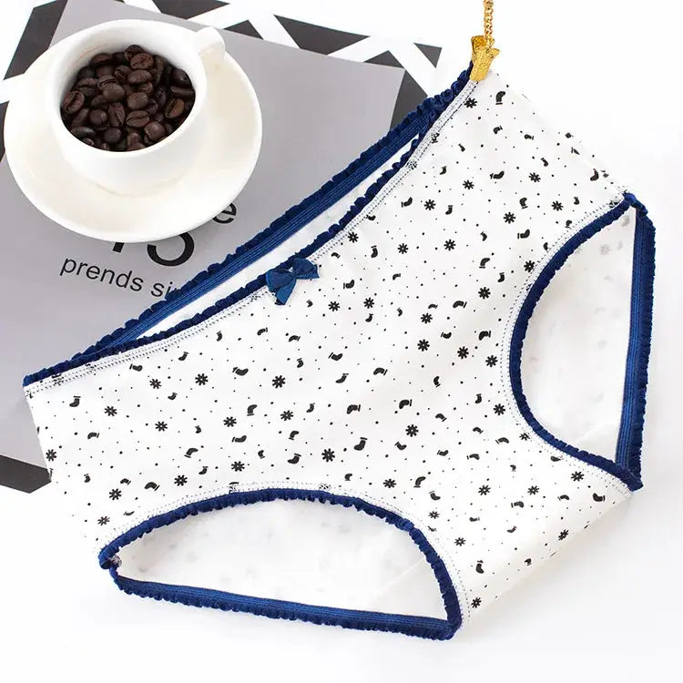 Women's cotton seamless panties with blue trim, white fabric with small black print and bow detail, 1 pair.