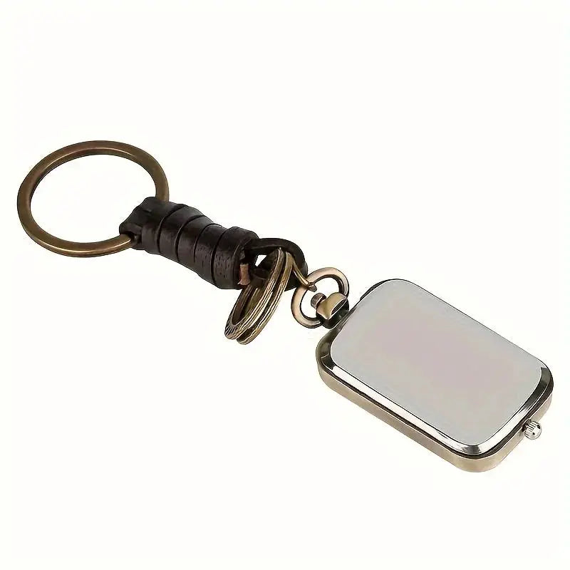 Pocket watch keychain with square silver case, black leather strap, bronze ring