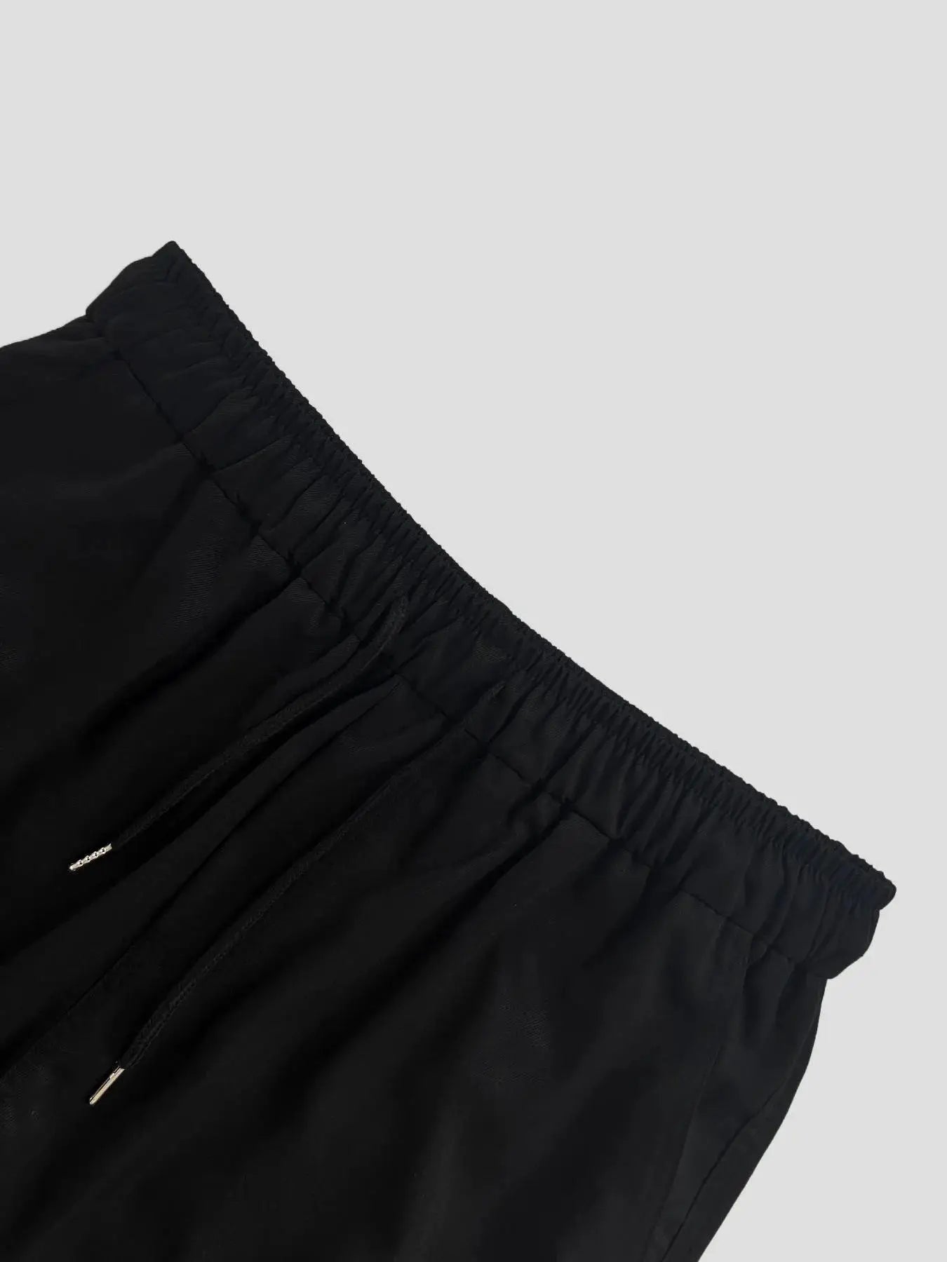 Men's cargo pants by Simples Market in black with elastic drawstring waist, regular fit
