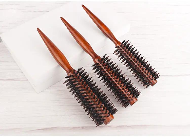 Set of three wooden-handle round barrel hair brushes with boar bristle for styling.