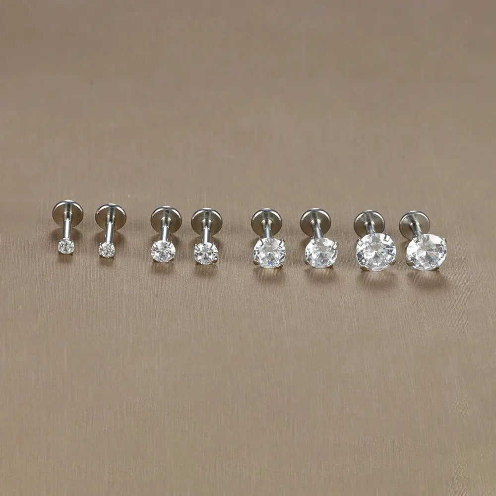 Labret tragus stud earrings set in surgical stainless steel with clear CZ crystals, 9-piece display
