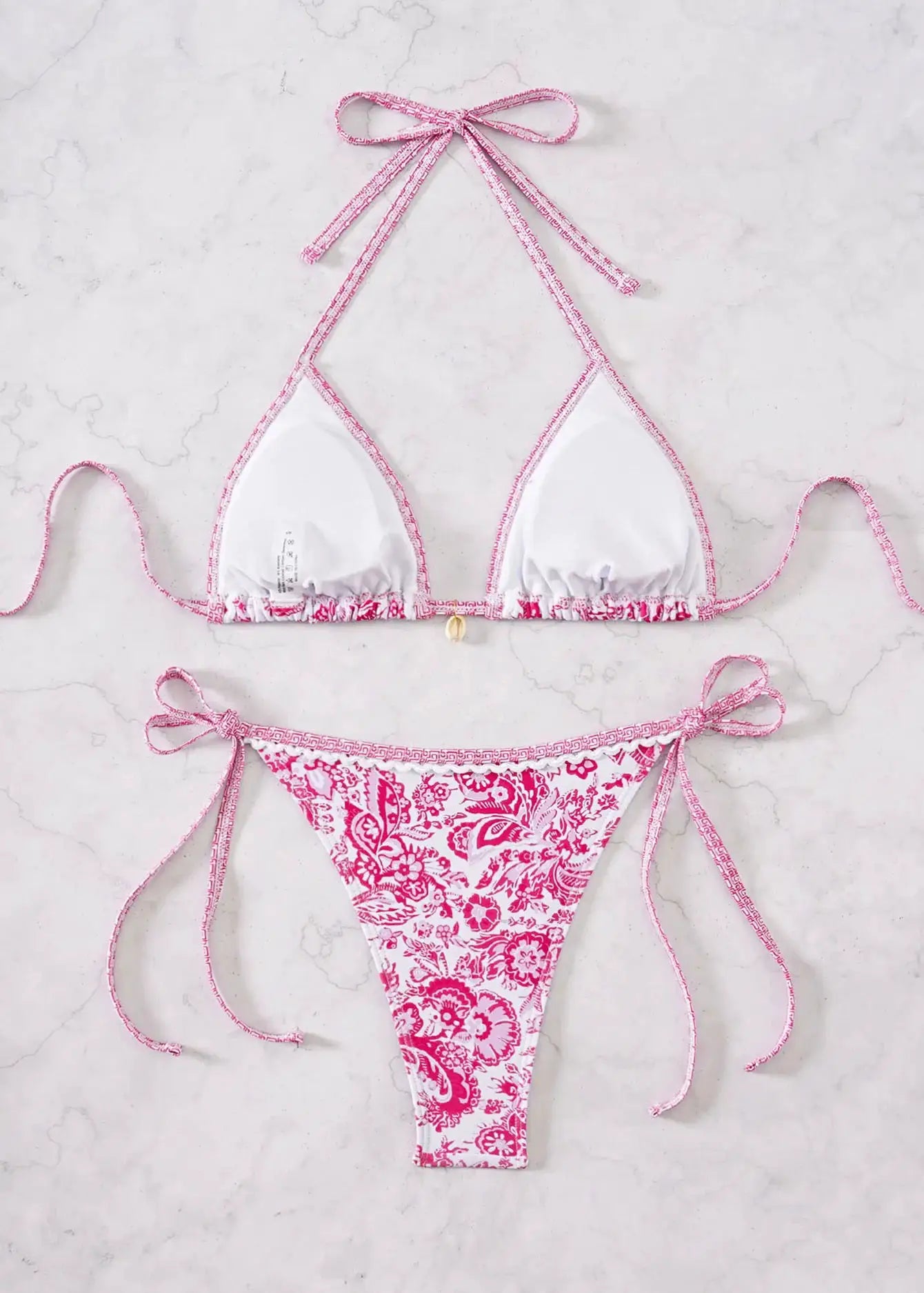 Simples Market triangle bikini set: white triangle top with pink trim and ties, pink floral Brazilian bottoms (2-piece)