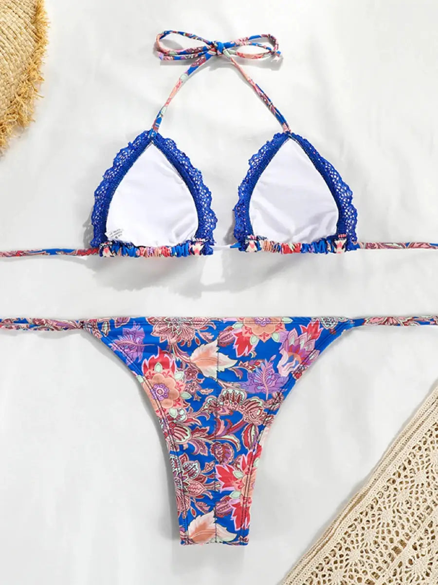 Two-piece floral bikini set with blue lace-trimmed white triangle top and matching blue floral bottom