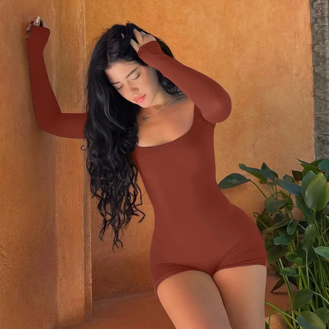Hugcitar rust long-sleeve playsuit with scoop neckline, slim fitted romper on model