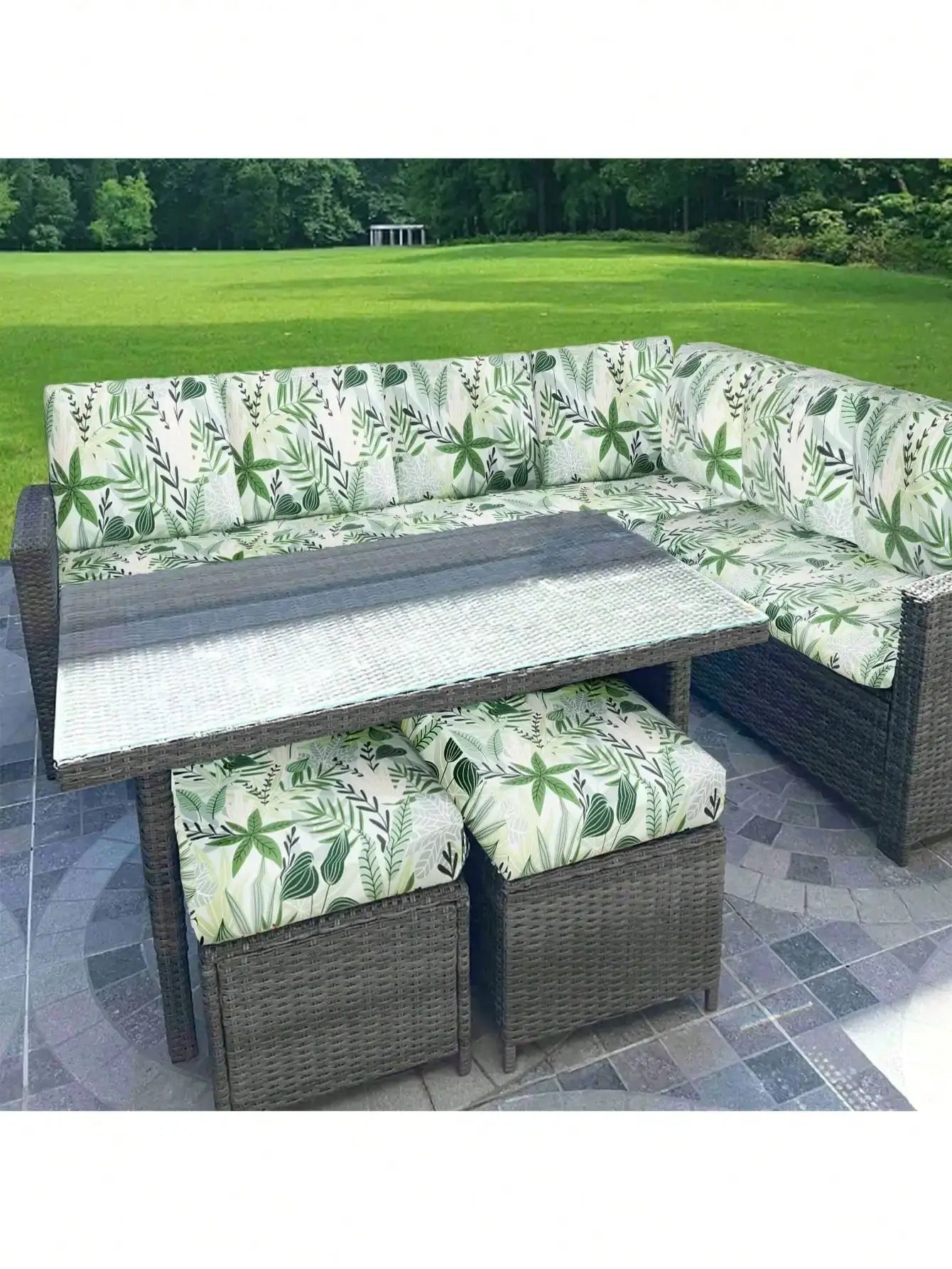 Outdoor tropical leaf print sofa cushion covers in green for wicker sectional by Simples Market.