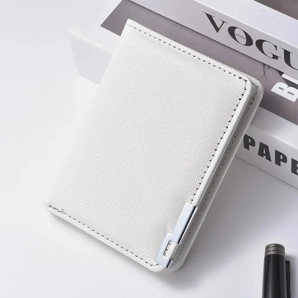 White faux leather small slim business-style wallet with textured crosshatch surface and metal clasp