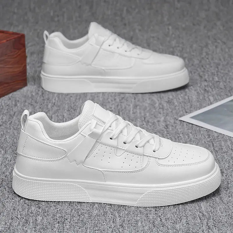 Men's white casual sports shoes with perforated toe and chunky sole; two shoes visible