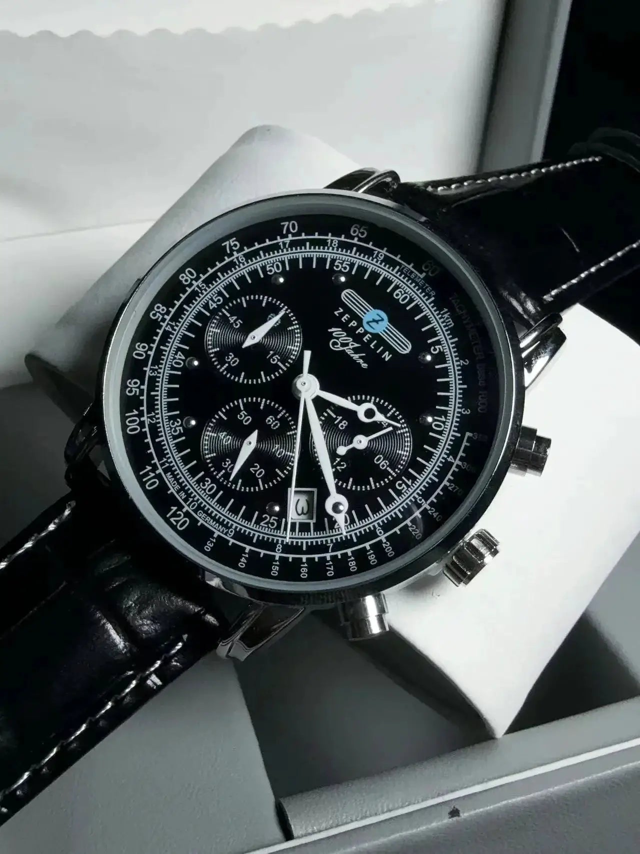 Zeppelin automatic chronograph men's watch with black dial, silver case and black leather strap.