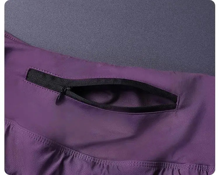 Purple women's 2-in-1 shorts with back zip pocket, lightweight breathable fabric