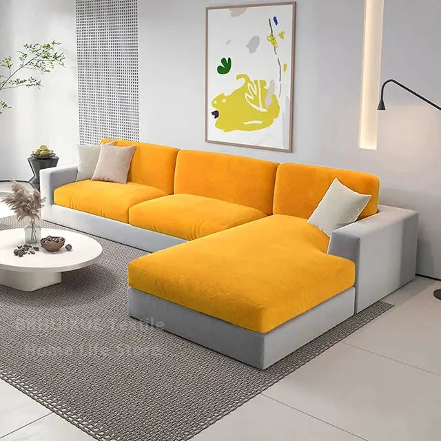 Velvet sofa seat cushion covers in bright yellow for an L-shaped sectional with a gray base