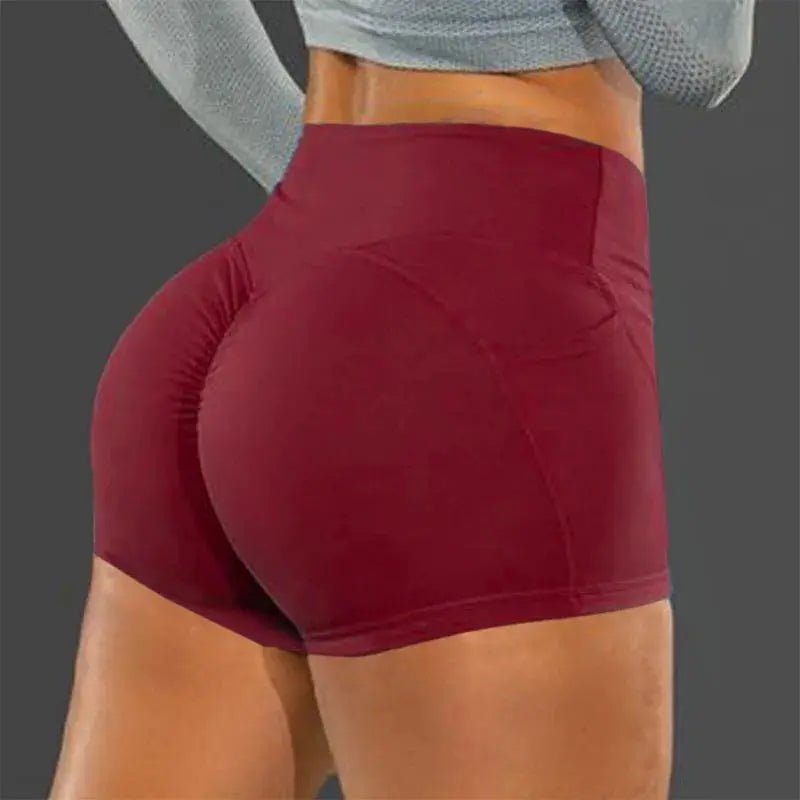 High-waist hip-lifting seamless fitness shorts by Simples Market in burgundy, back view.