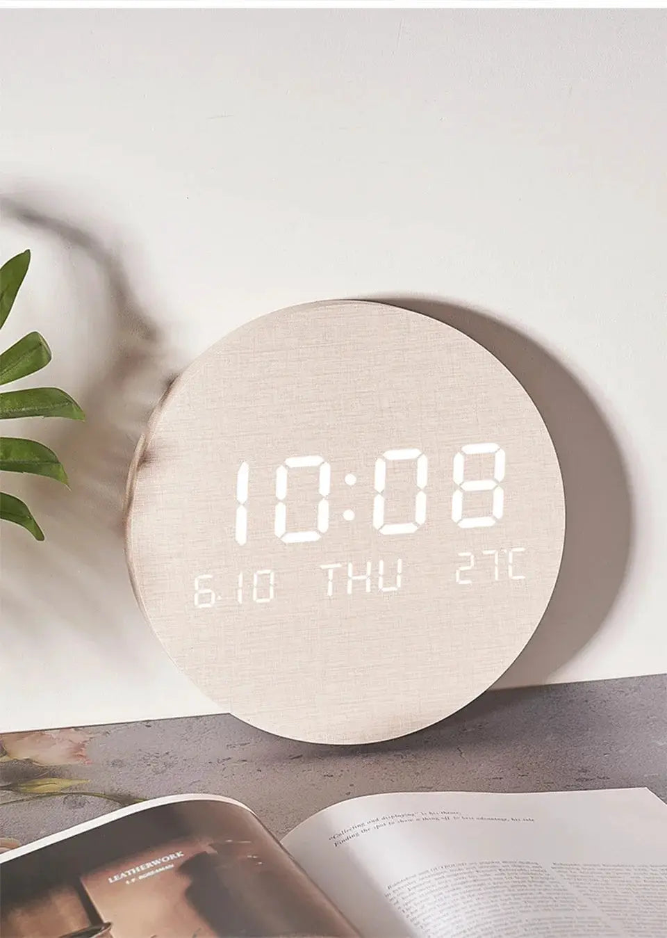LED digital wall clock with a round beige wood finish showing time, date and temperature.