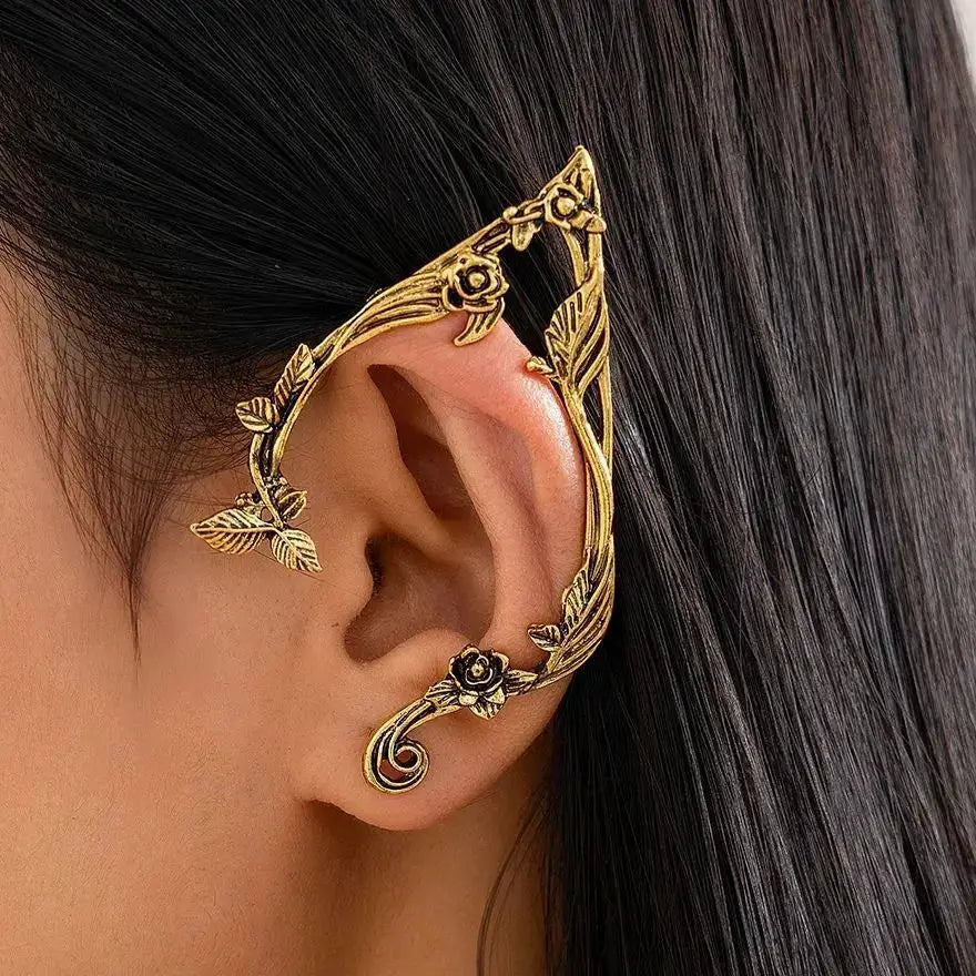 Gold elf leaf ear clip by Simples Market, ornate floral vine ear cuff jewelry
