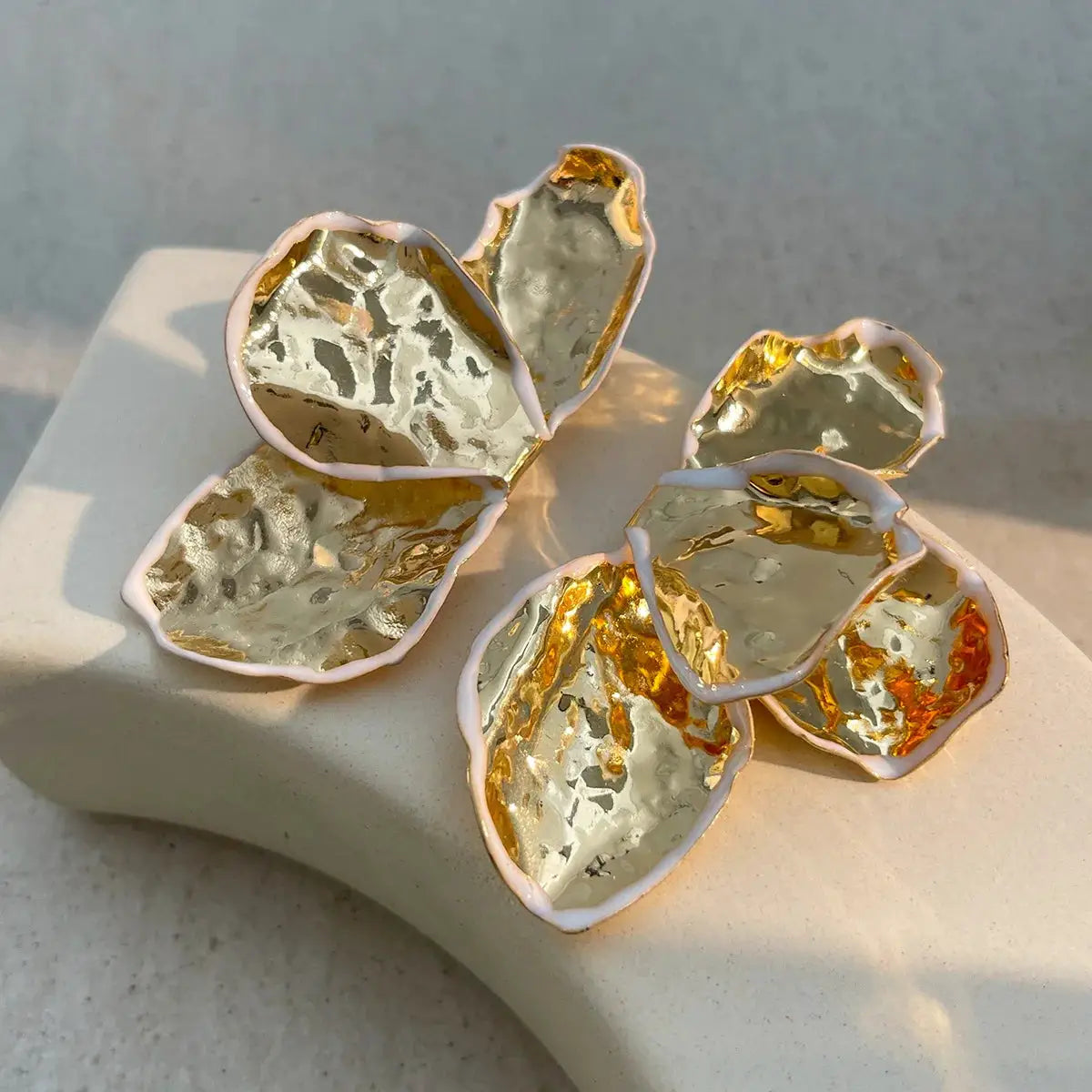 Metal irregular pleated petal earrings with pink-edged gold and silver petals
