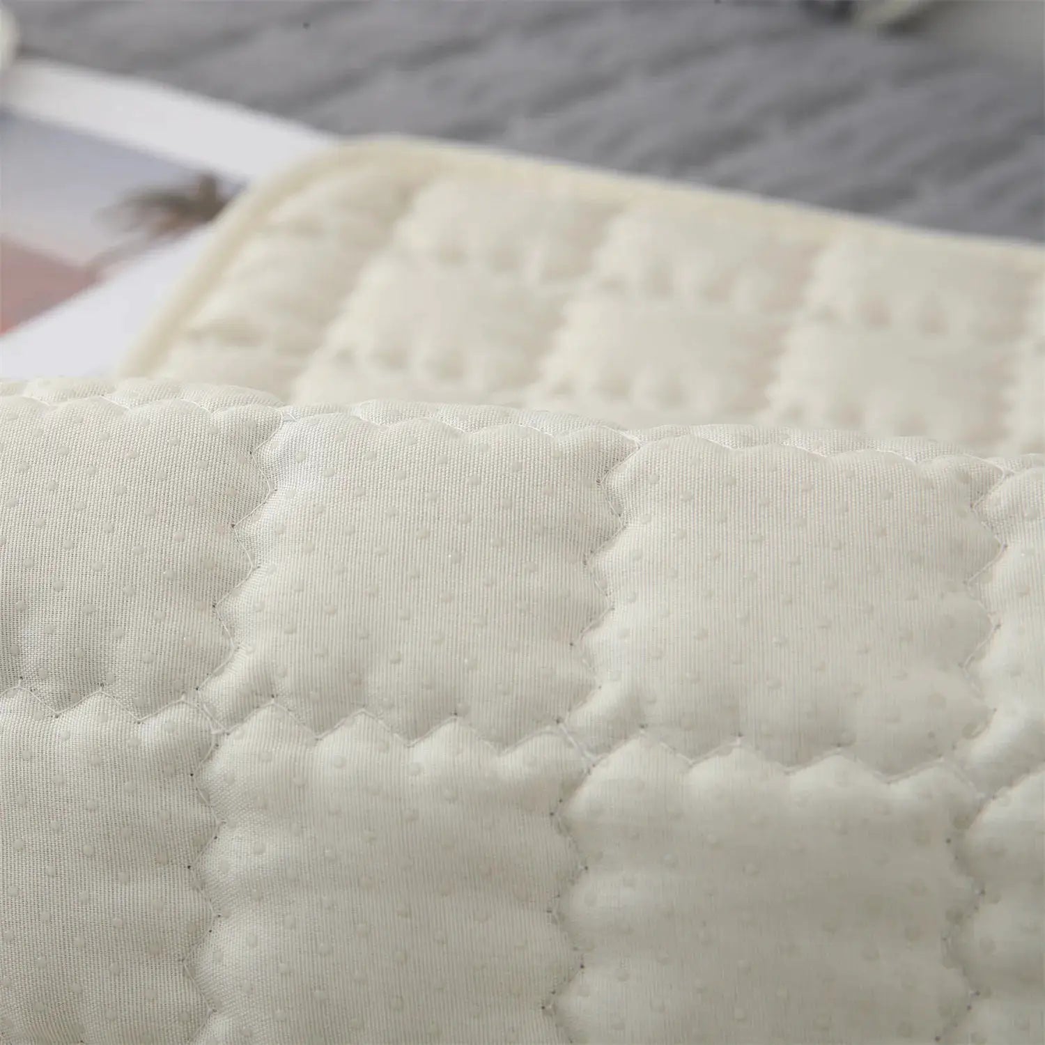 Cushion cover for sofa, cream quilted fabric with dotted texture