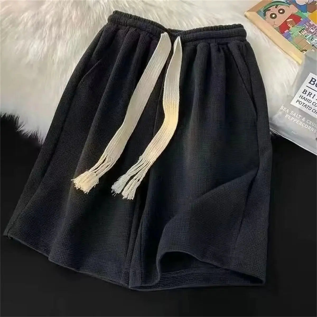 Men's black solid breathable shorts with white drawstring; lightweight, casual basketball-style sports shorts