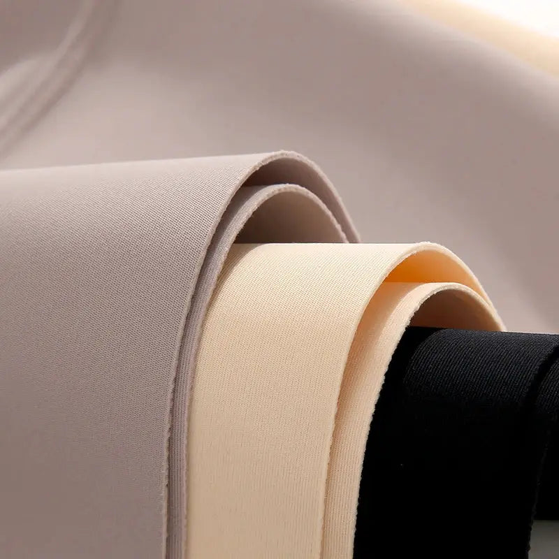 Seamless underwear fabric swatches in nude, beige, ivory, and black