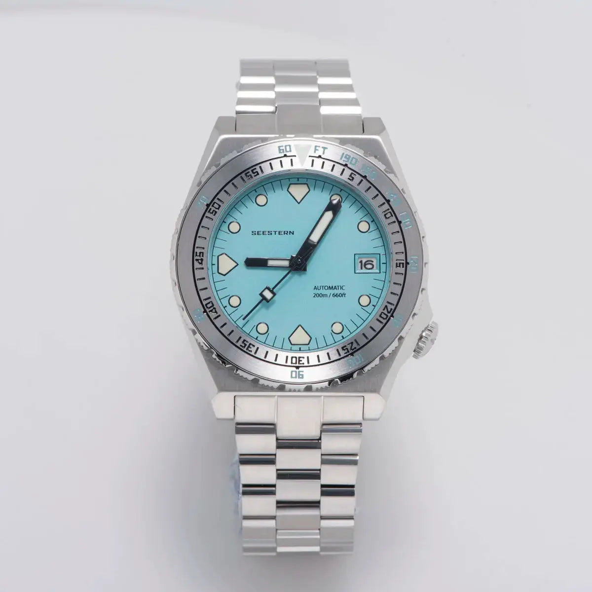 Seestern SUB600T diver watch with turquoise dial and stainless steel bracelet.