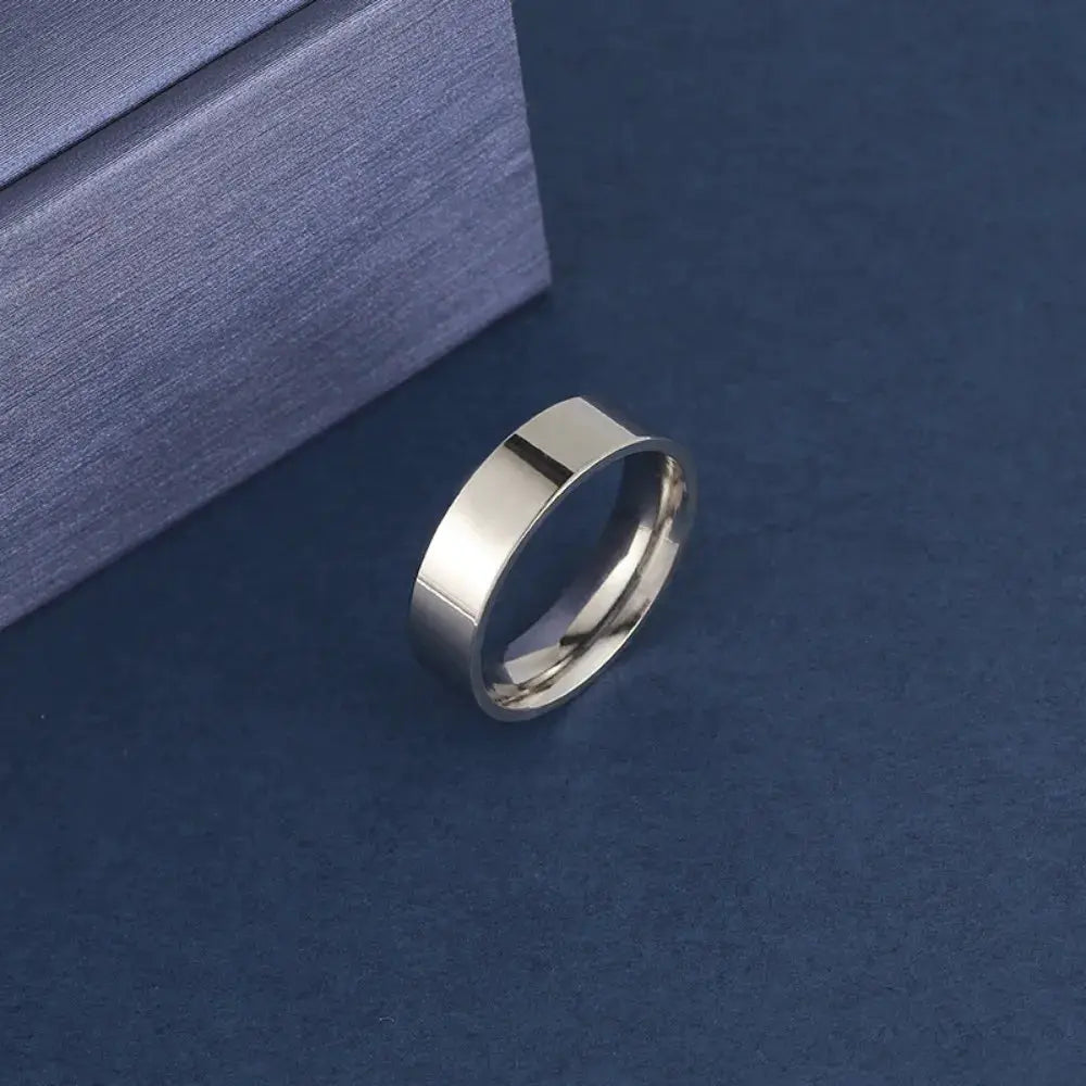 Unisex stainless steel ring with a polished silver finish for men and women.